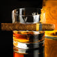 Cigar holding whiskey glass