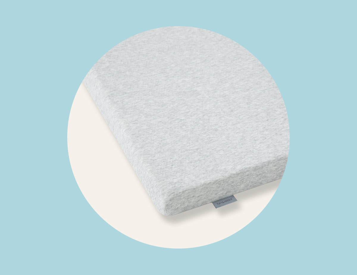 Picture of the corner of the mattress topper by Tuft & Needle, a dorm room essential