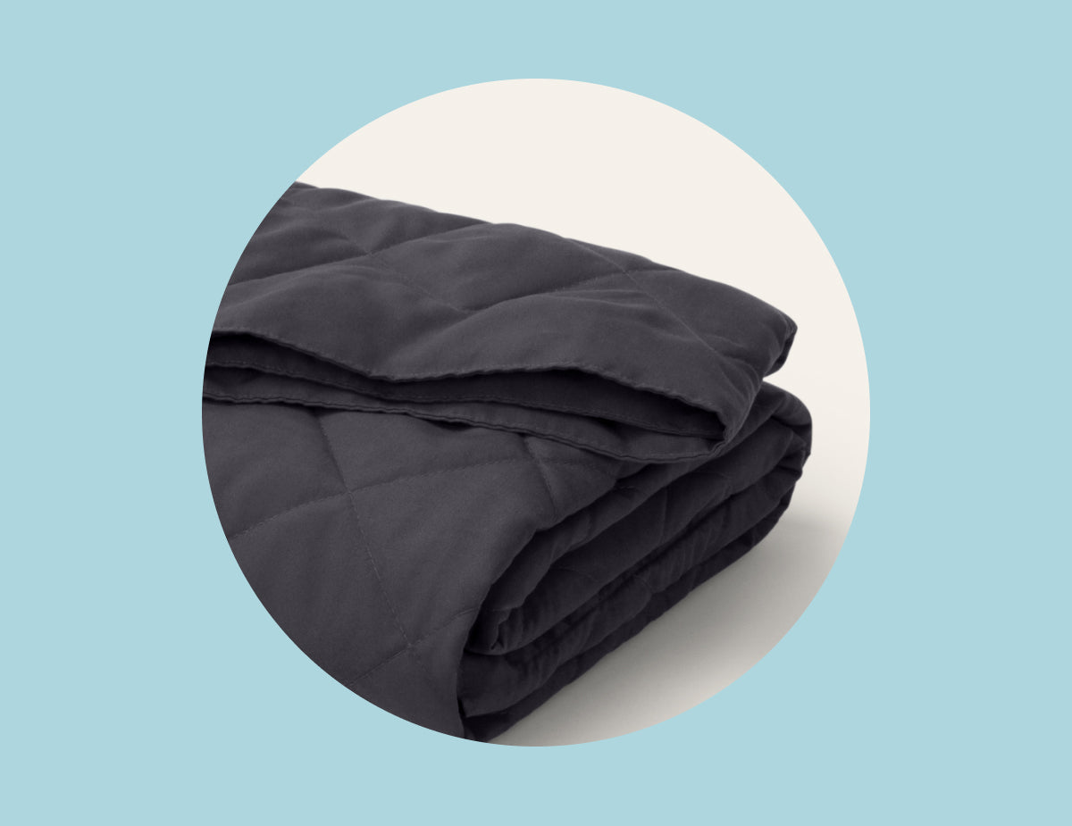 Picture of the corner of the Anywhere Travel Blanket by Tuft & Needle, a dorm room essential