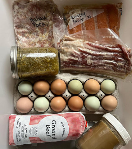 aerial shot of a larder, a collection of preserves, cured meat, and eggs