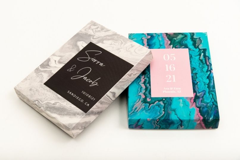 Two custom presentation boxes featuring Save The Date imagery