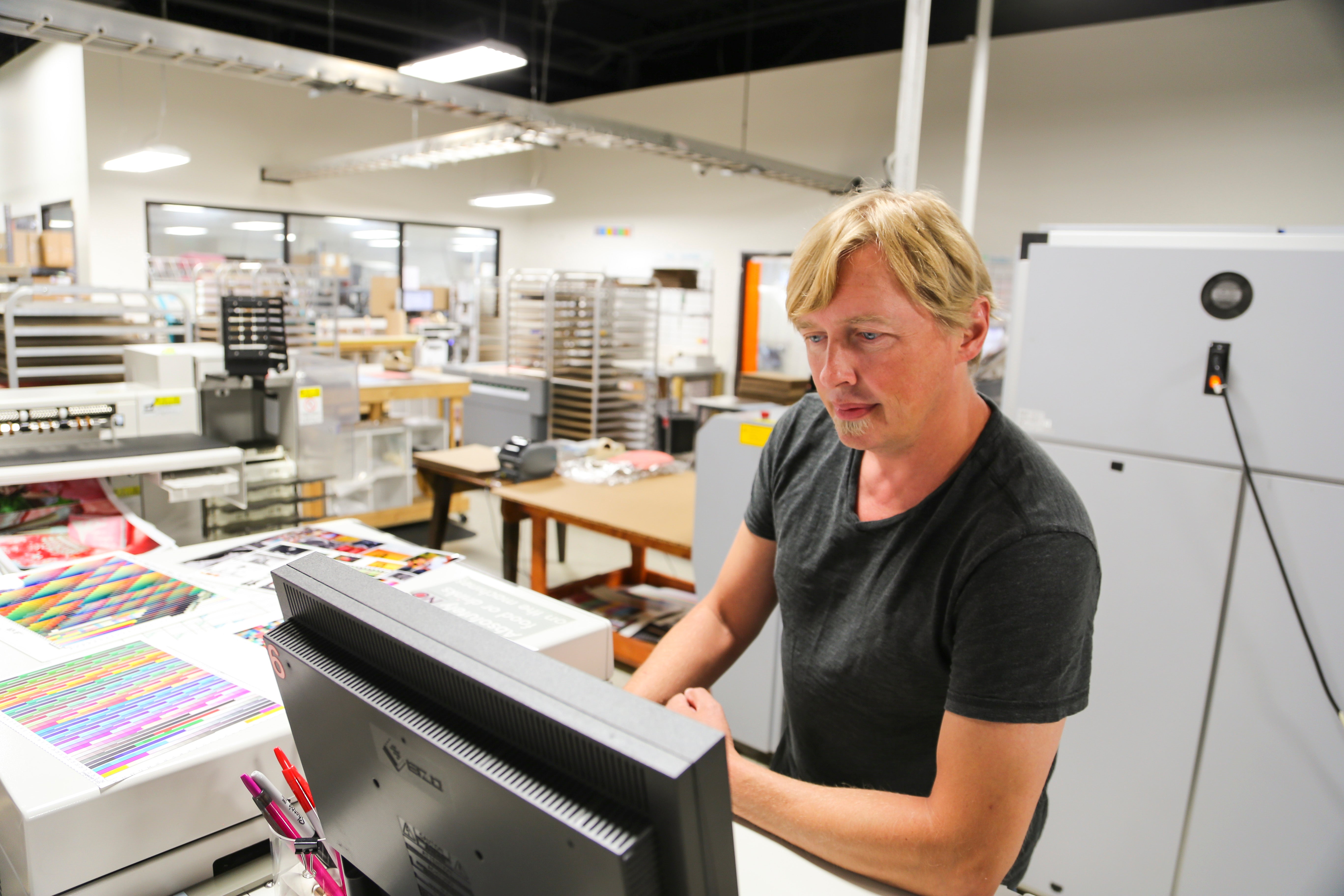 Tom Schell calibrating a monitor at Nations Photo Lab