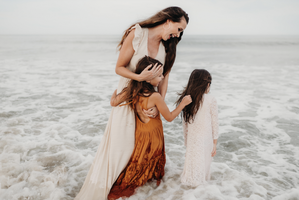 mom with daugthers on beach