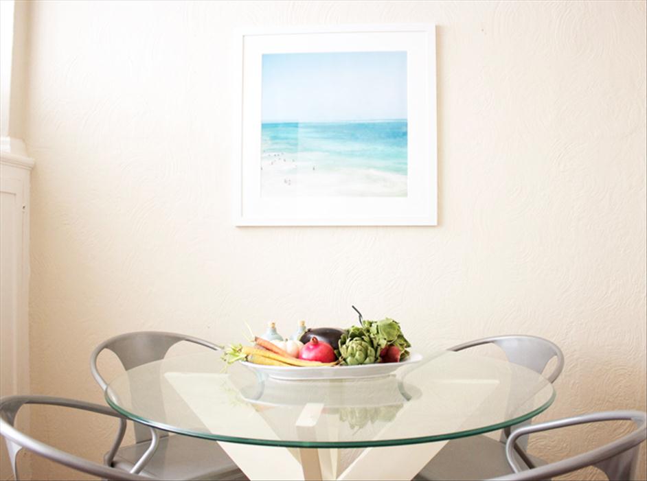 Framed photo of Tulum hung over table