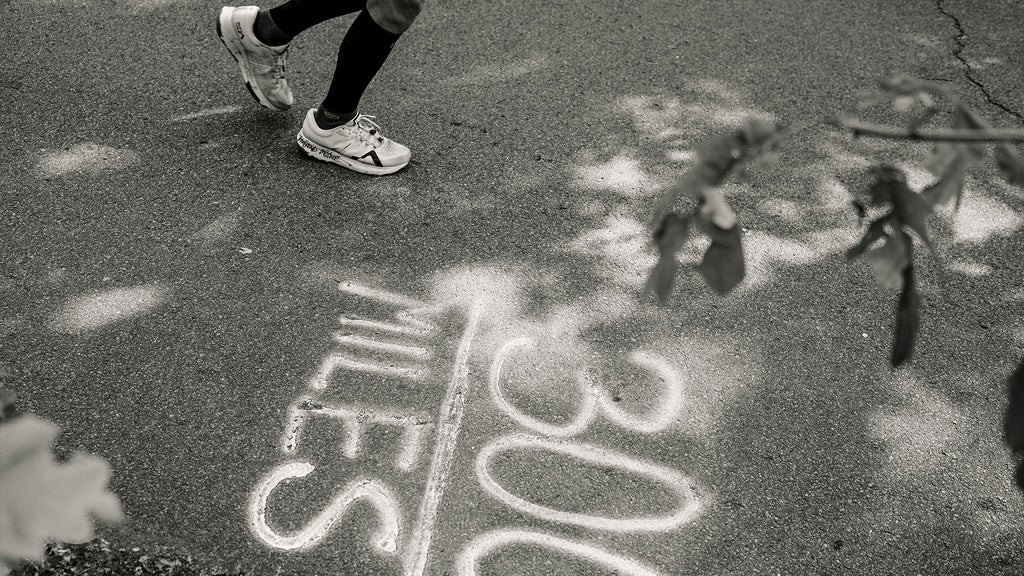 Ultrarunner Matthieu Bonne crossing the "300 MILES" mark in Mount to Coast’s R1 shoes.