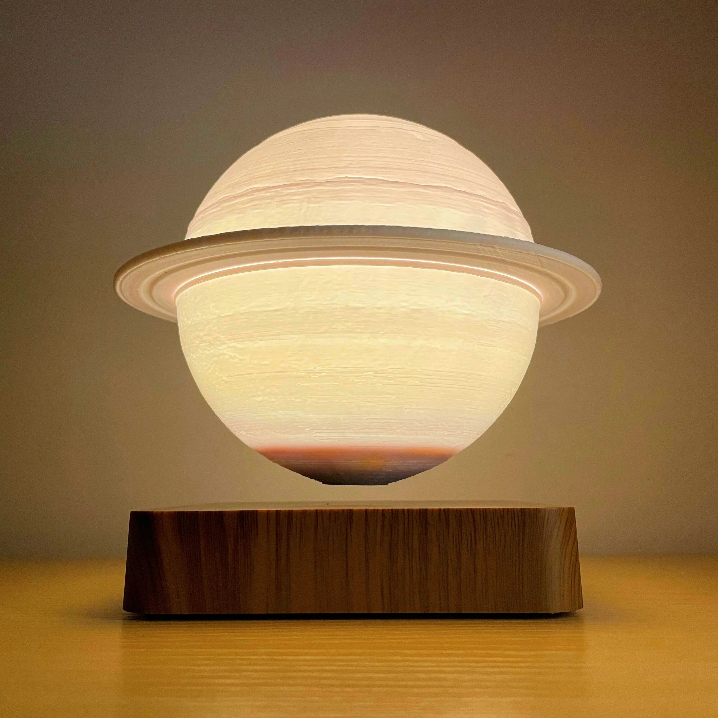 Floating Saturn Lamp creating a serene ambiance in a bedroom