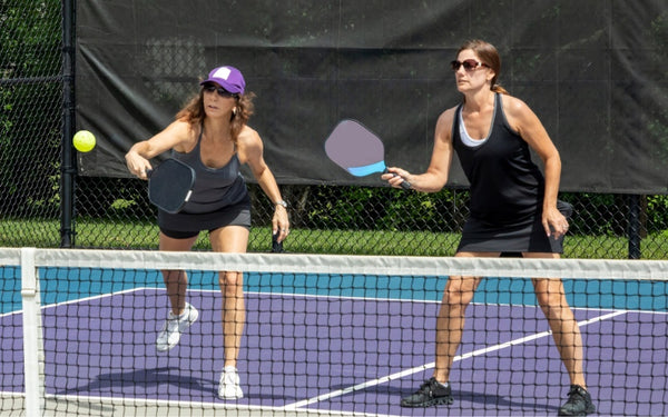 Ladies playing pickleball