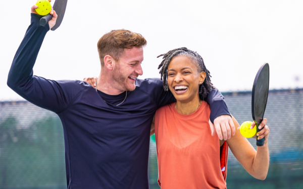 Pickleball couple laughing