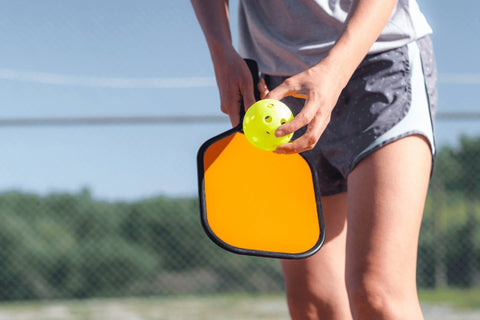 Woman is Serving in the Pickleball Game