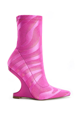 hot pink fashion forward heeled boots with striping detail and angled heel