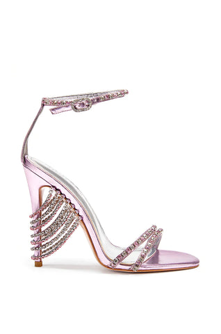 Elegant metallic pink open toe stiletto sandals with crystal embellished cords draping the heel as well as a chic ankle strap closure