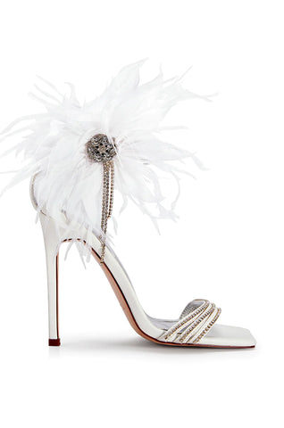 white open toe stiletto heels with rhinestone detail and feathered flower accent on the side