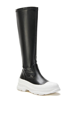 black flat platform faux leather boots with a chunky white sole