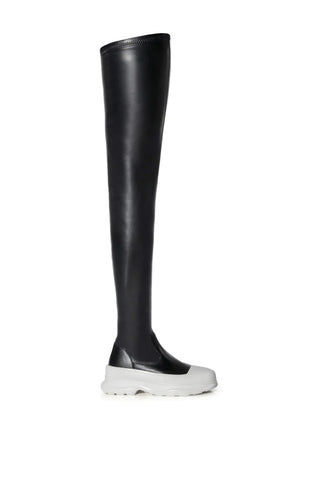 thigh high faux leather platform boots with a white sole