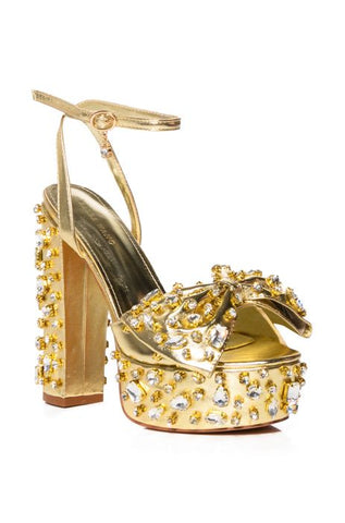Shiny gold platform heels with rhinestone embellished detail