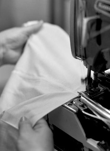white t-shirt being manufactured