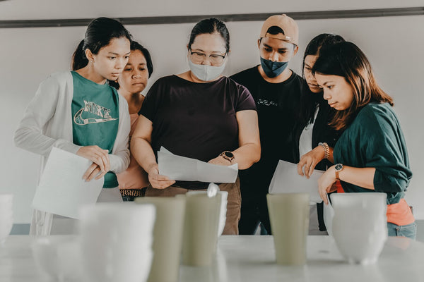 Curve Coffee Collaborators CEO Cherry Cruz hosting a cupping workshop for the young farmers in Bukidnon