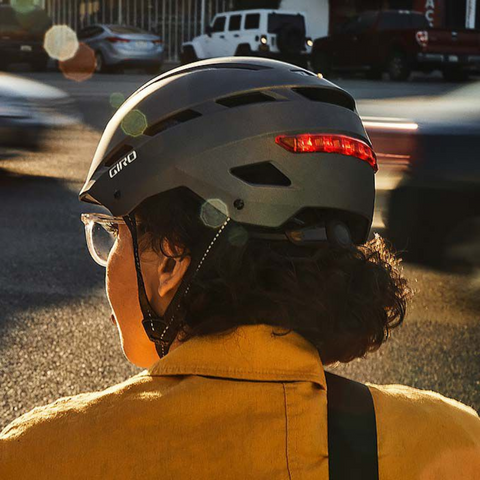 A woman wearing a Giro cycle helmet