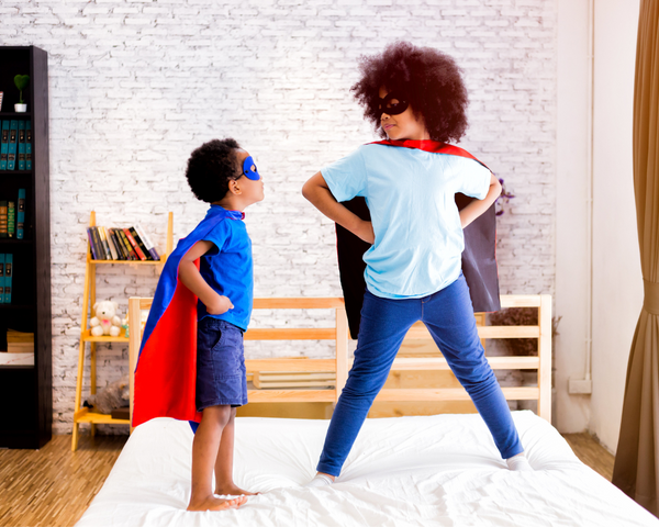 two kids playing superhero