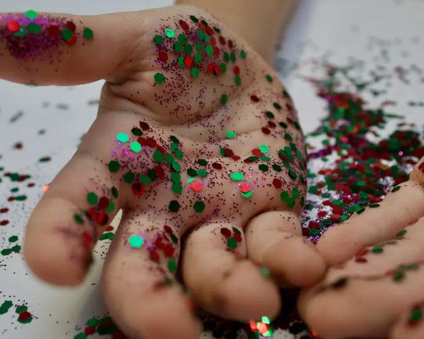 kid's hand with glitters