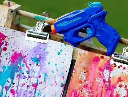 Kids Outdoor Summer Activities. Squirt Gun Painting Outdoor Craft.