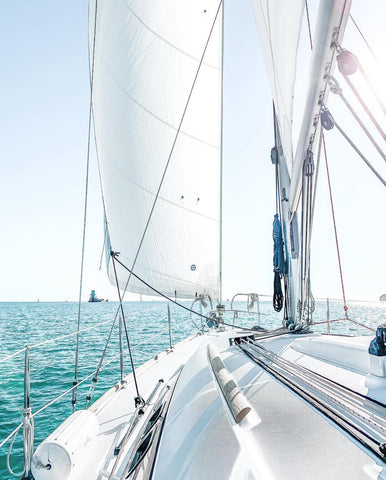 a sailboat on crystal blue waters