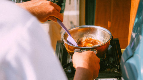 Chef cooks mulled syrup over the stove to serve on top of Super Batter pancakes