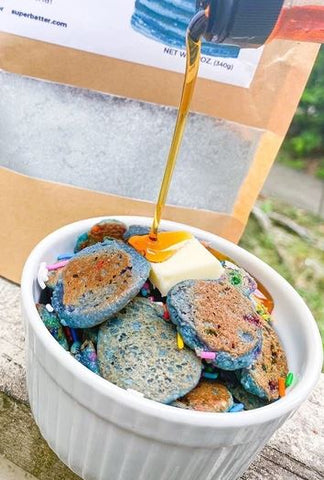 Funfetti Pancake Cereal with blue mini pancakes and sprinkles made using Super Batter Blue Matcha Pancake & Waffle Mix