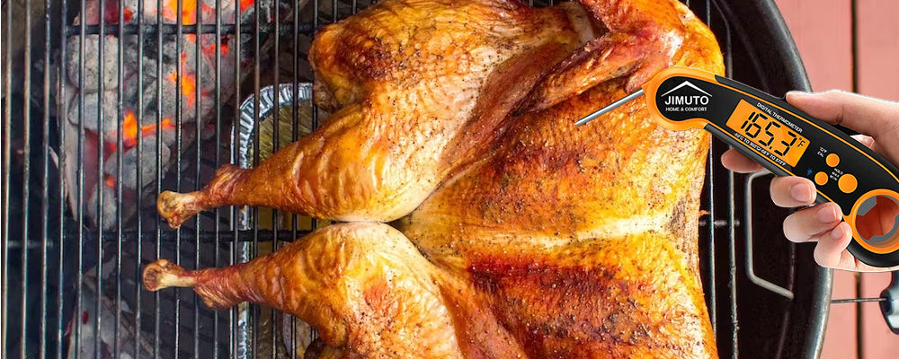 a grill master is showing where to put a meat thermometer into a turkey when grilling