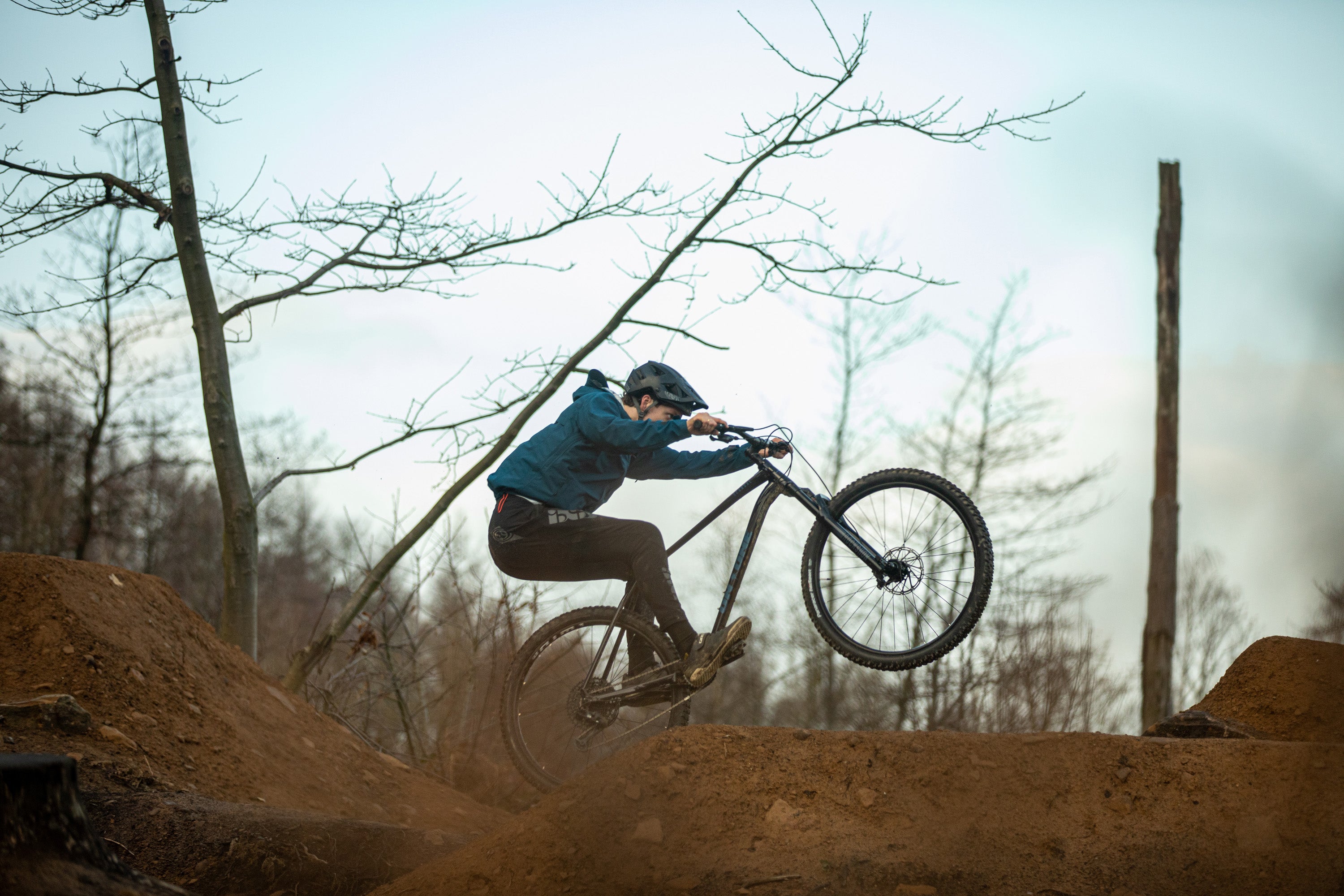 MTB cyclist on one wheel