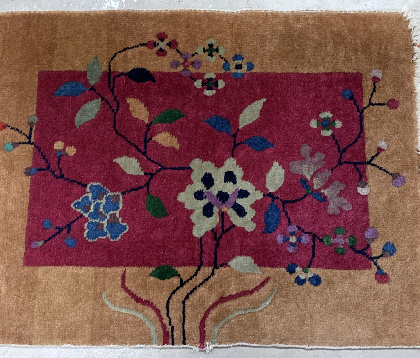 Handmade antique Art Deco Chinese rug in deep red and . The rug is from the beginning of 20th century in original good condition. 