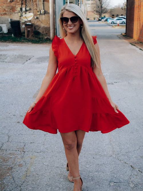 Dress features a tomato red color, short sleeves, ruffle detailing ...