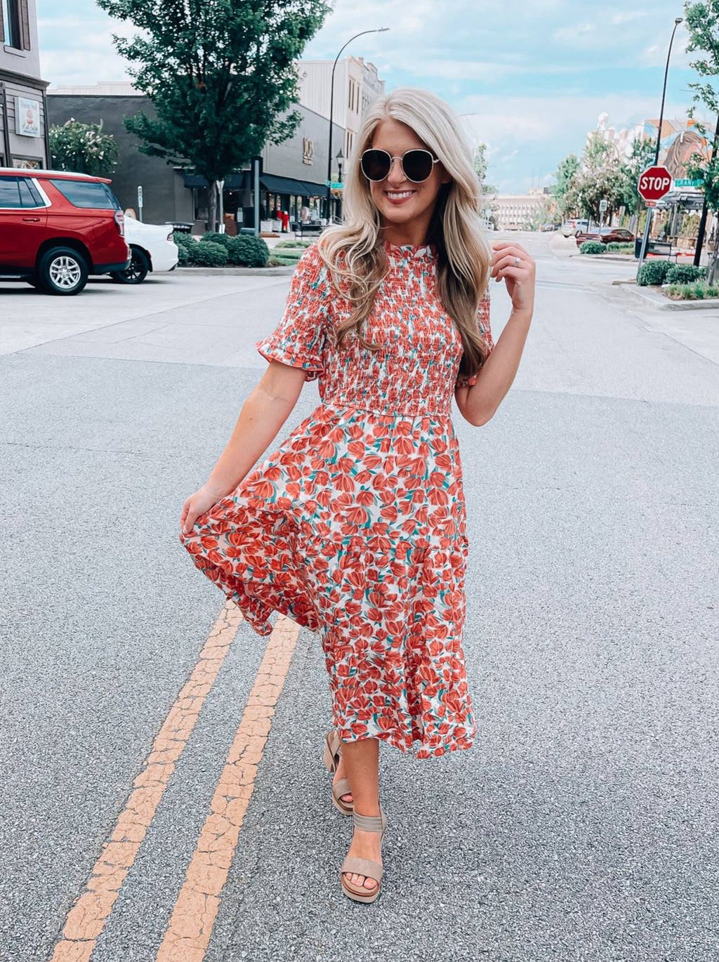 Dress features a coral and white floral print, short sleeves, smocked ...