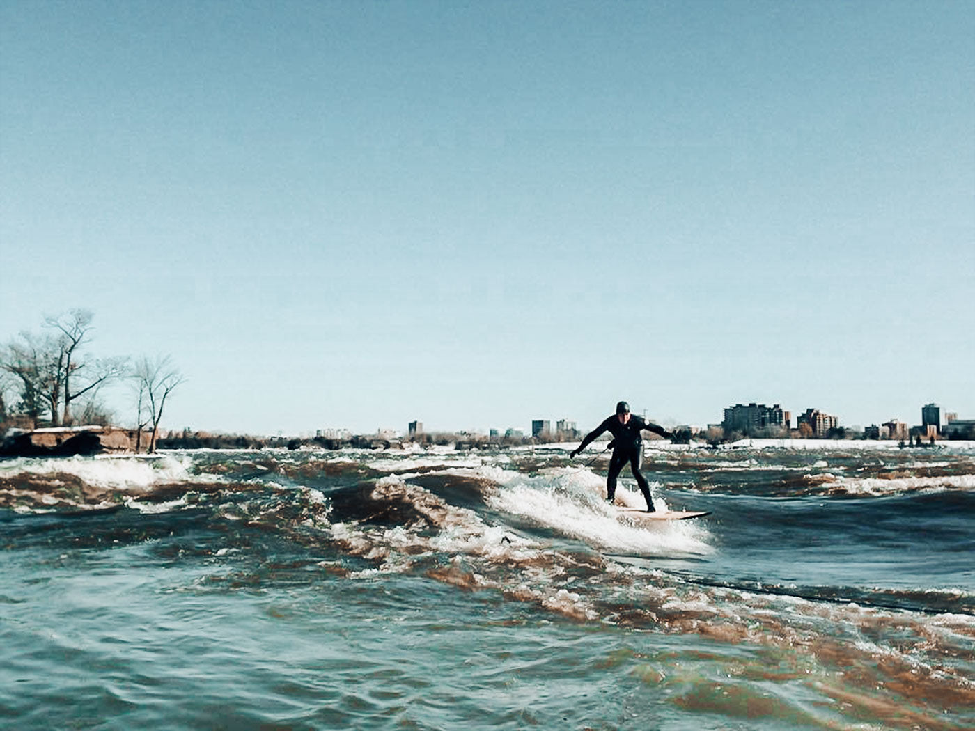 Michael Billinger River Surfing in the winter in Ottawa