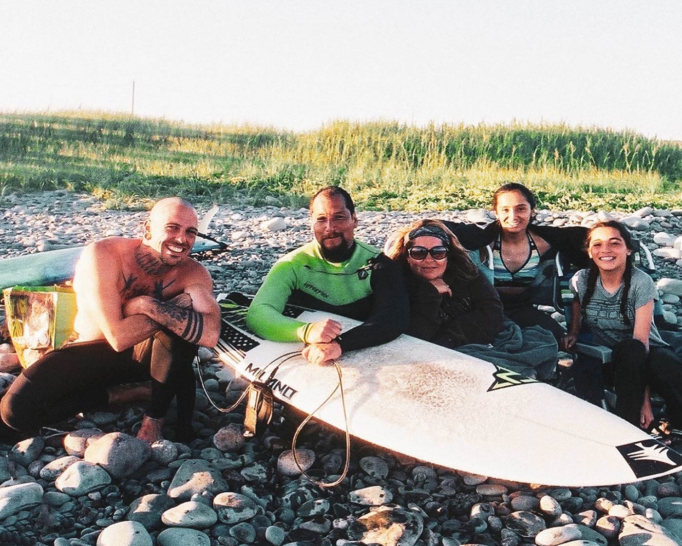 Larry Cavero and his family surfing in Nova Scotia
