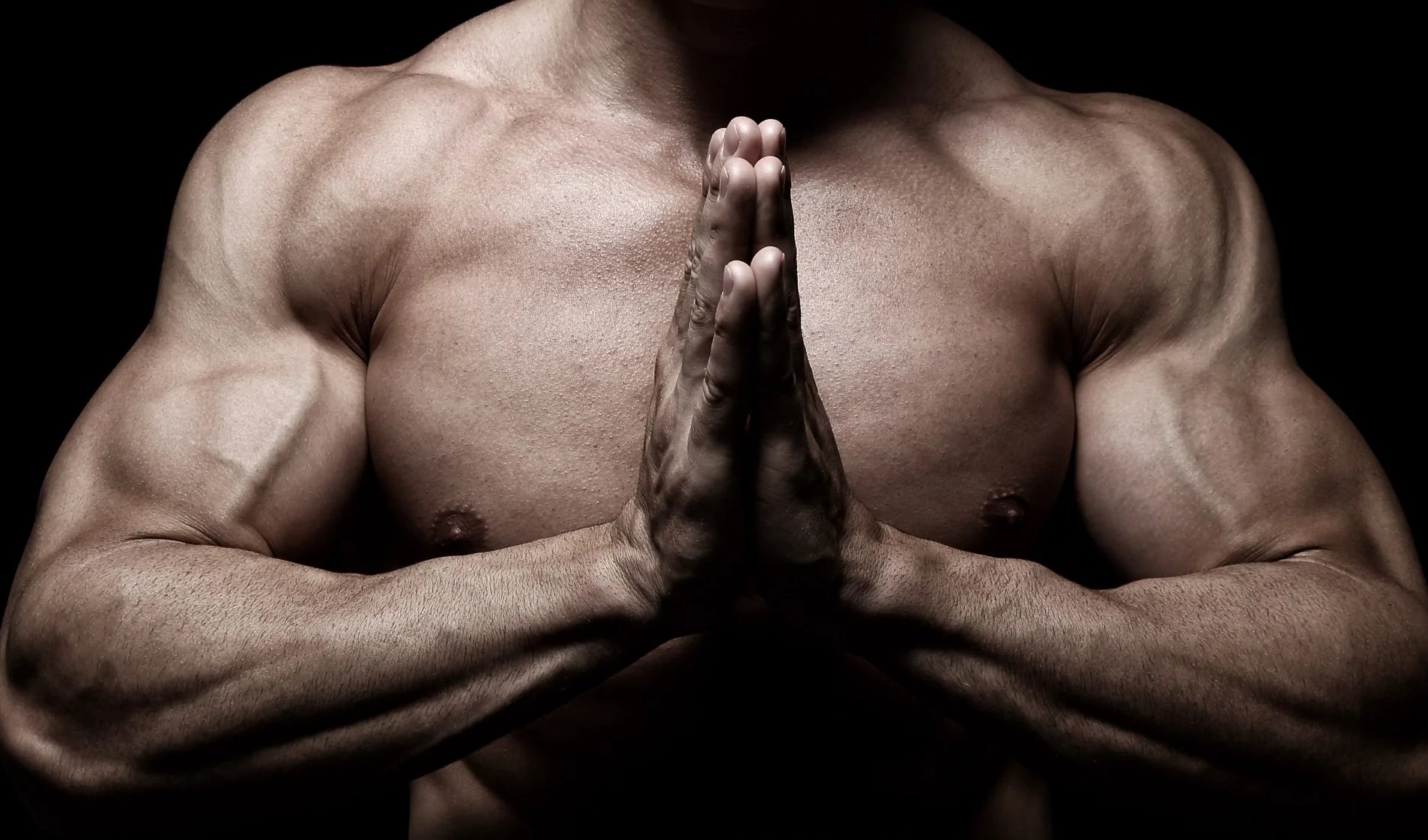 Muscular man with no shirt flexing and praying with hands. Supple Drink supplement with glucosamine. Tip: Strong muscles help with joint pain.