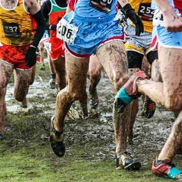 Men in cross country race. Only see legs. Supple joint supplement with glucosamine. Tip: Weight management helps with knee pain relief.