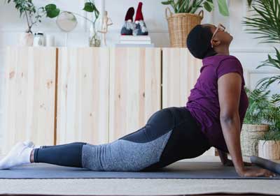 Supple Instant with glucosamine. Woman doing yoga, stretching up.