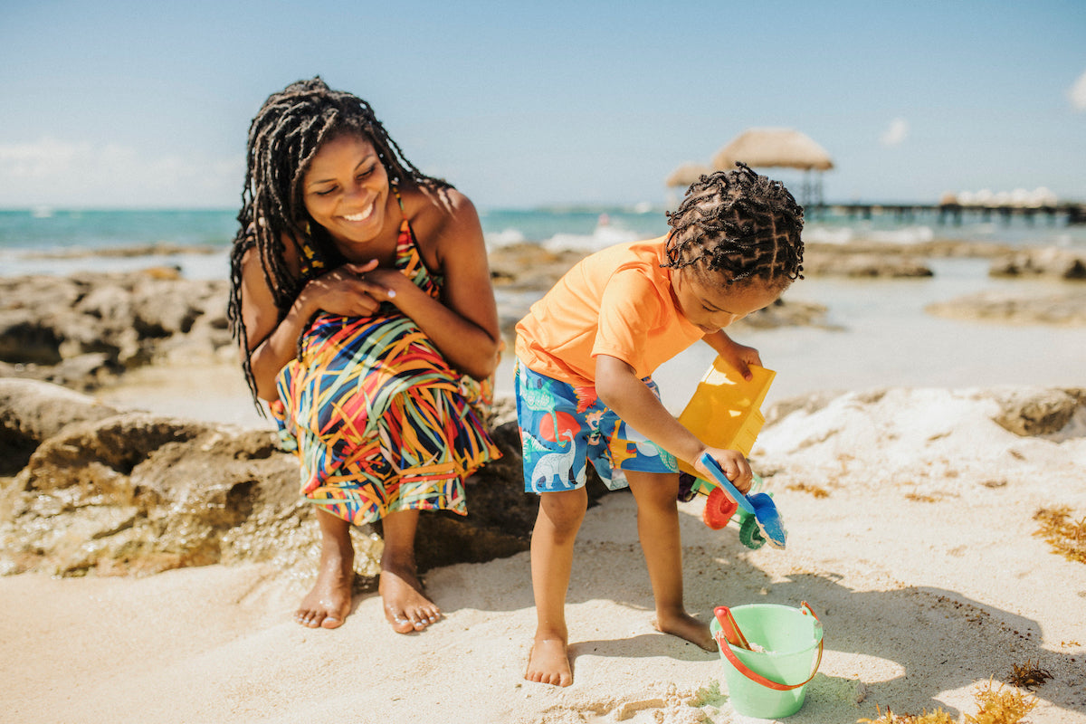 kid playing sand castle