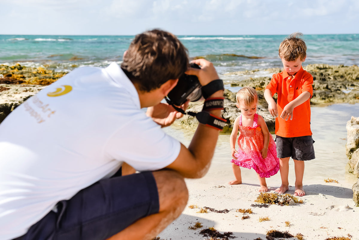 Photographer in action with kids at Vidanta Riviera Maya