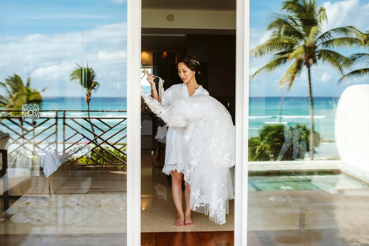 Bride with her wedding dress in the suite of Grand Velas Riviera Maya