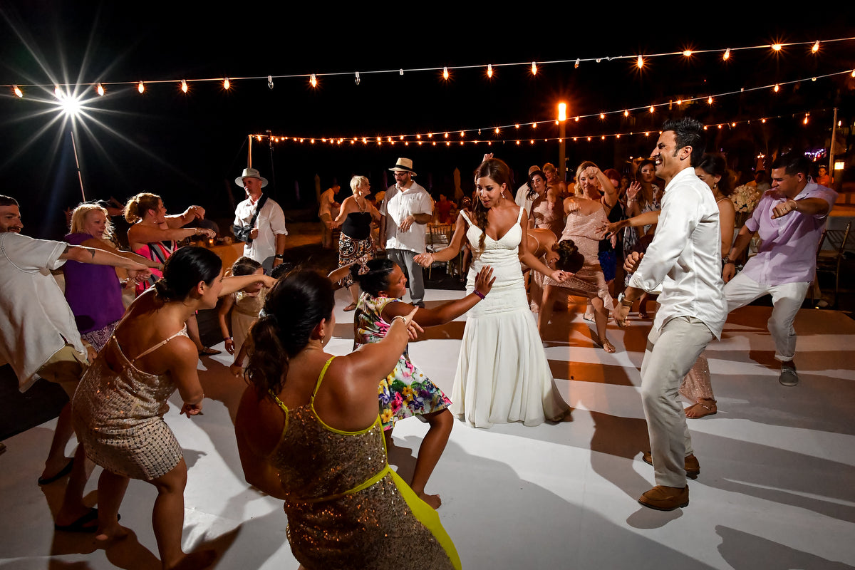 People dancing in a wedding reception at Playacar