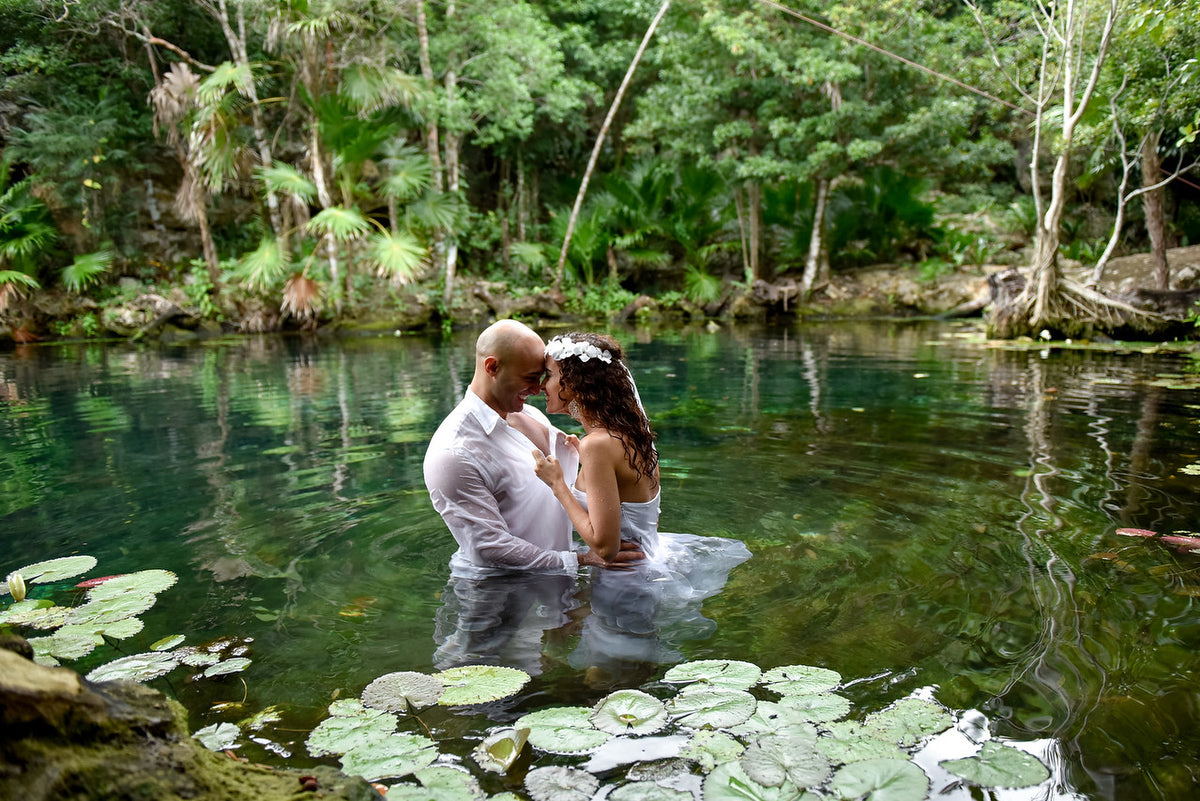 Romantic photo of a couple inside the cenote