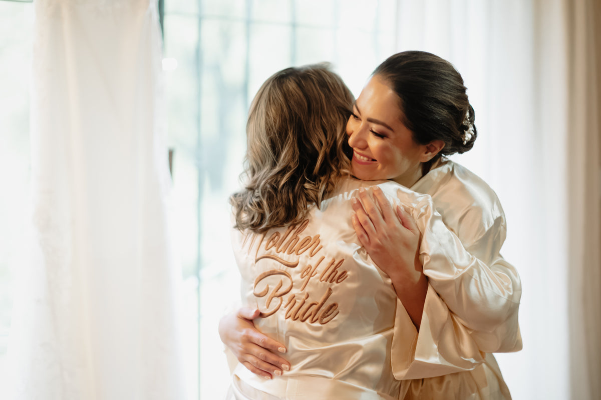 mother and bride hugg