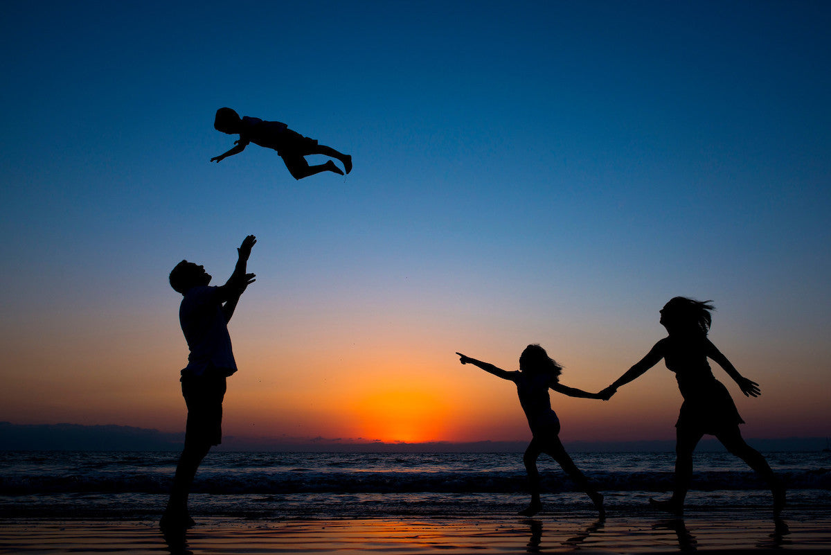 Family photo with a magic sunset at Puerto Vallarta (Mexico)