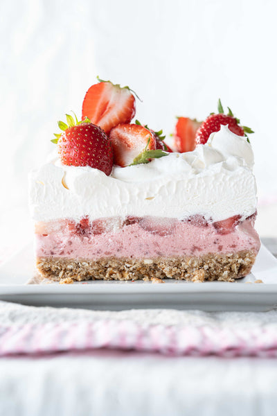 A strawberry icebox pie on a white plate.