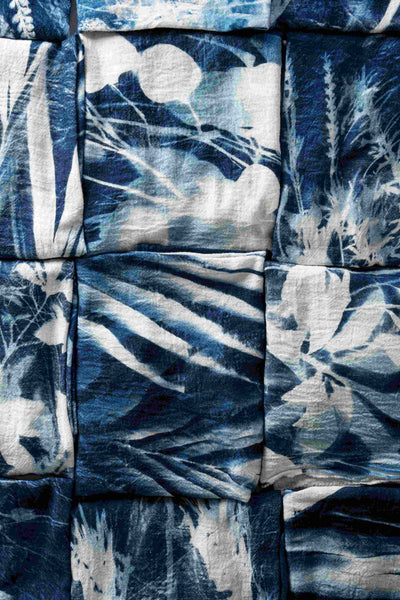 Finished cyanotype dyed napkins with floral designs