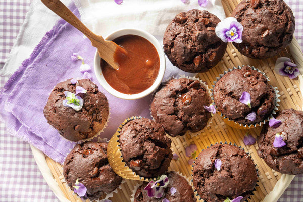 Chocolate muffins with whipped chocolate honey on a platter