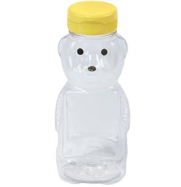 Empty plastic honey bear bottle.