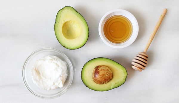 Coconut oil avocado and honey on a table